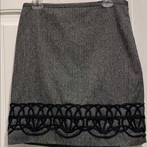 Flattering, accented with yarn embroidery at hem.